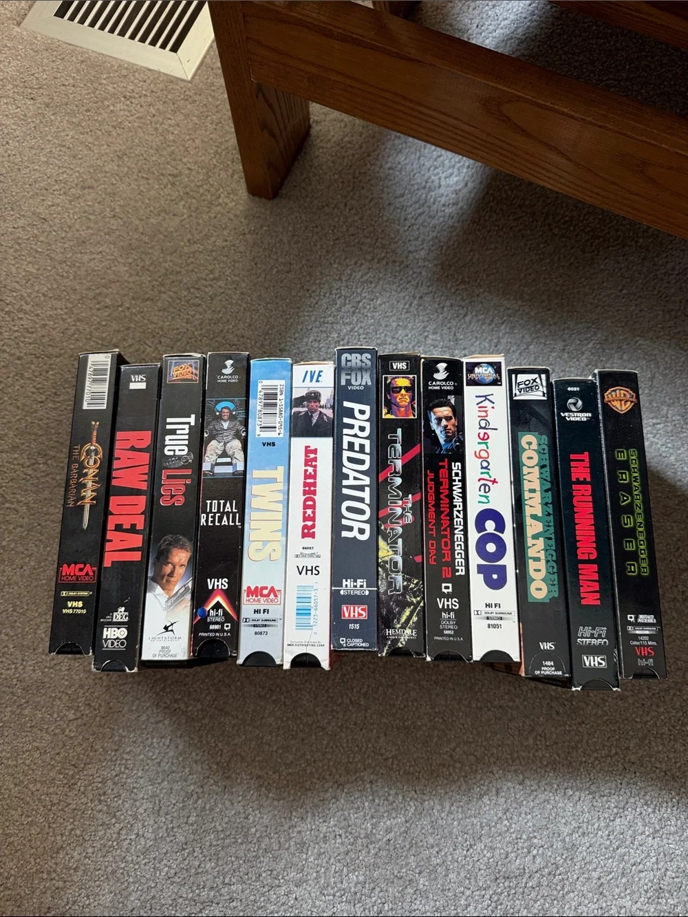 13 vintage Arnold Schwarzenegger action and comedy VHS movie tapes